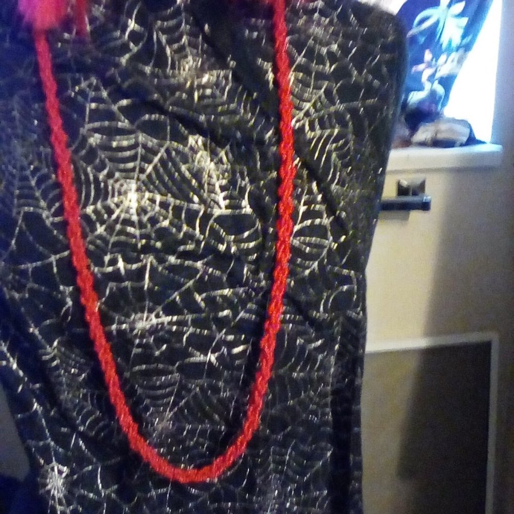 twisted triple strand red bead necklace